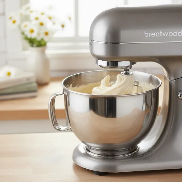 Brentwood 5-Speed stand mixer actively mixing light cake batter in its stainless steel bowl.